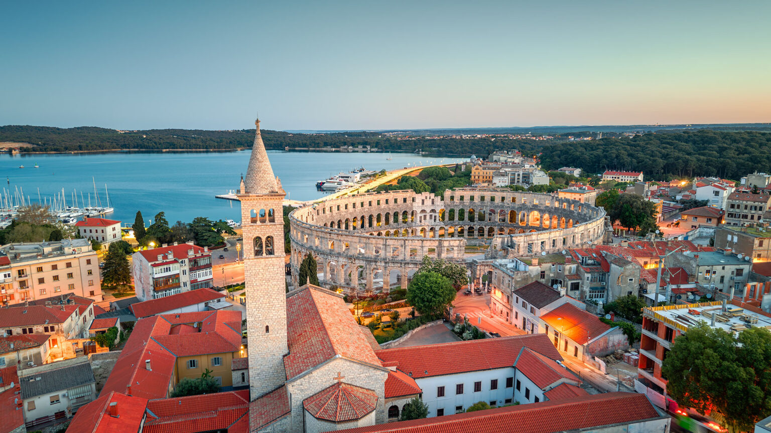 Aerial view of Pula Arena and the Adriatic coast near Medulin, Croatia